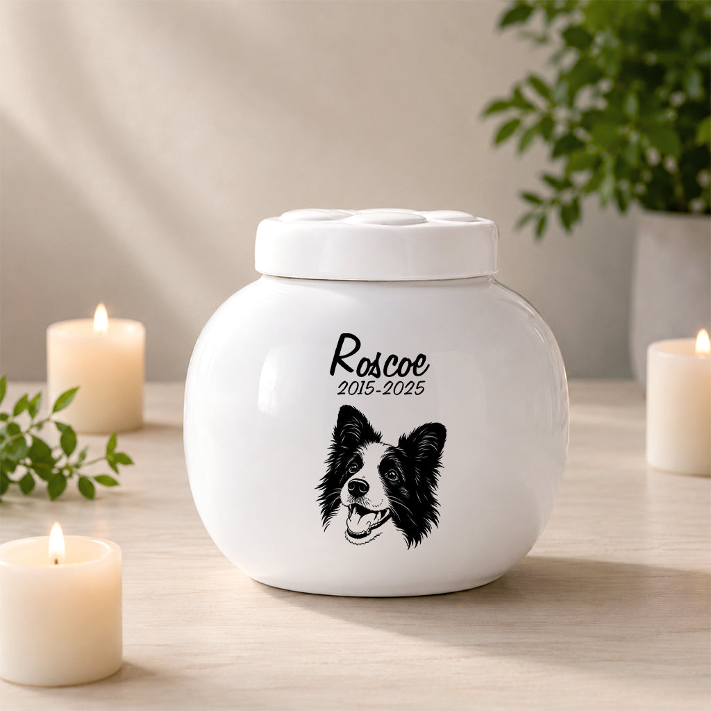 Custom dog cremation urn with a lift-off lid on white ceramic