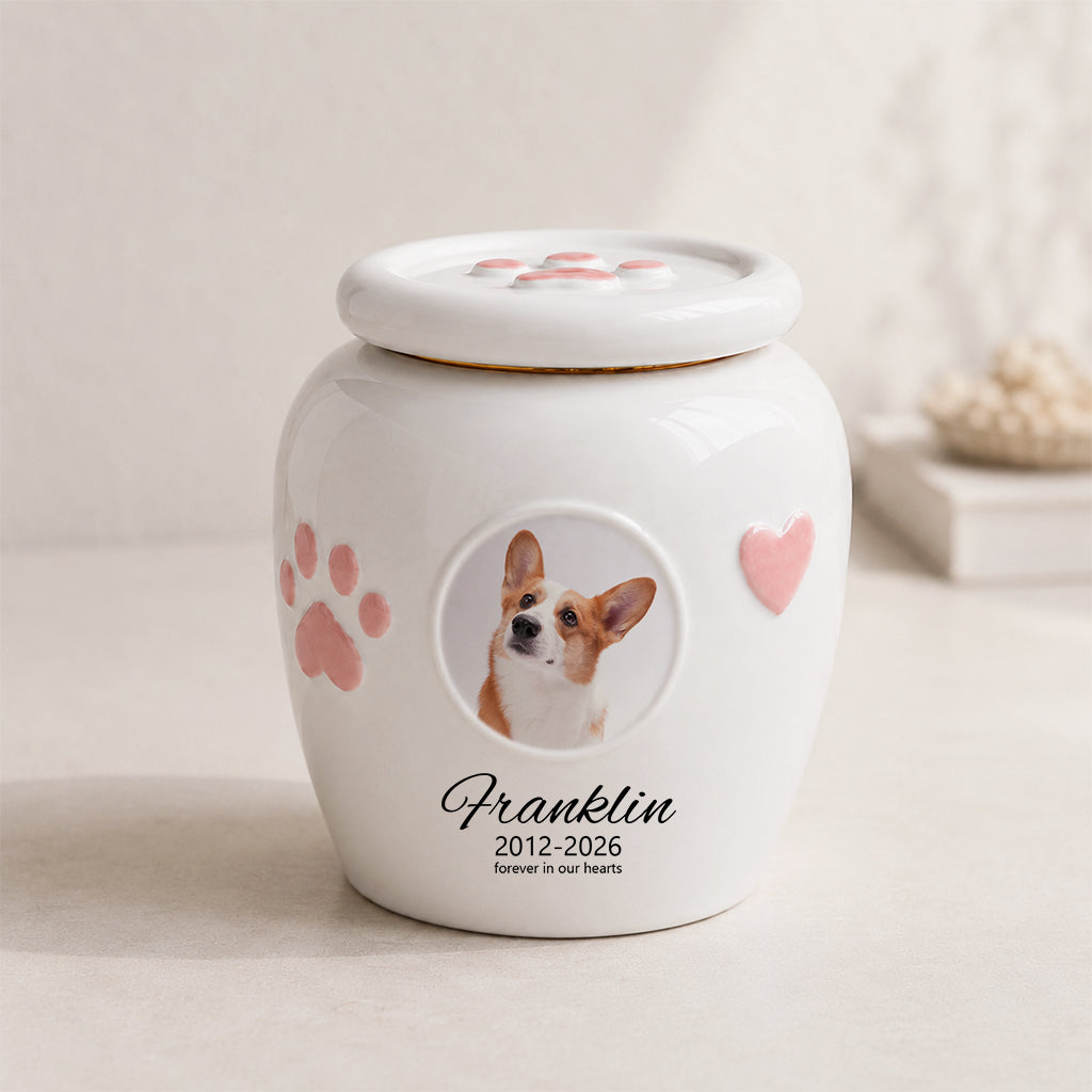 White ceramic dog urn with a circular photo window, in three sizes