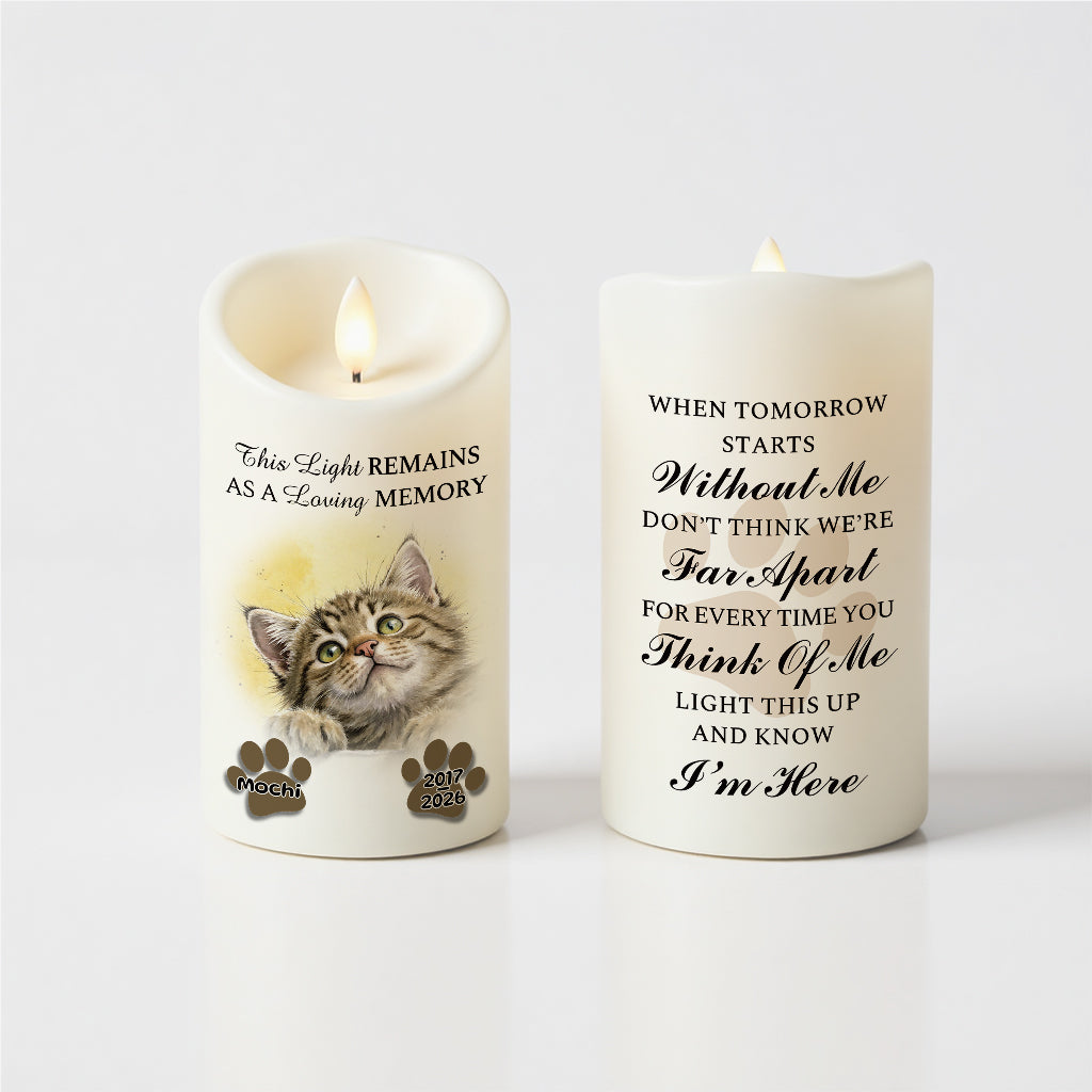 Back of peeking pet paw print memorial candle with engraved name, dates, and personal message