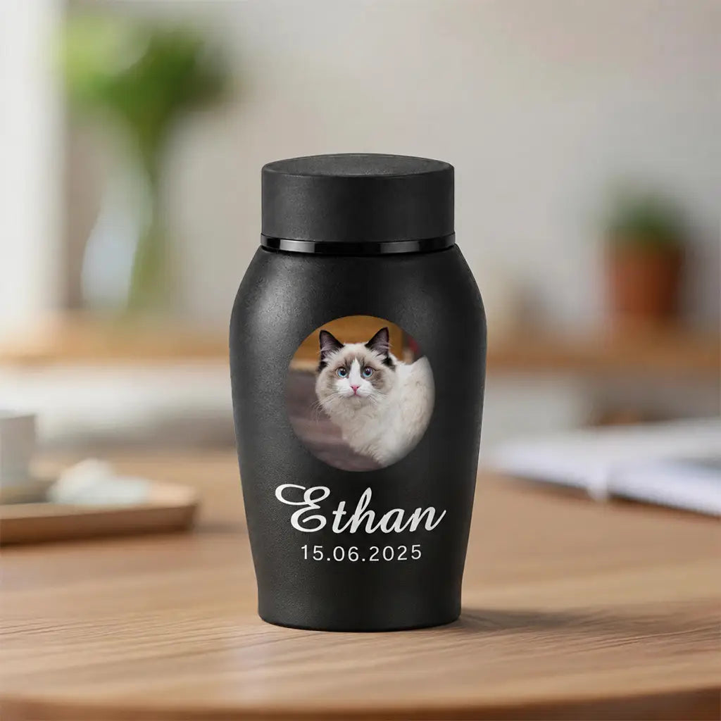 Personalized cat cremation urn with photo, name and dates printed on matte black stainless steel, front view