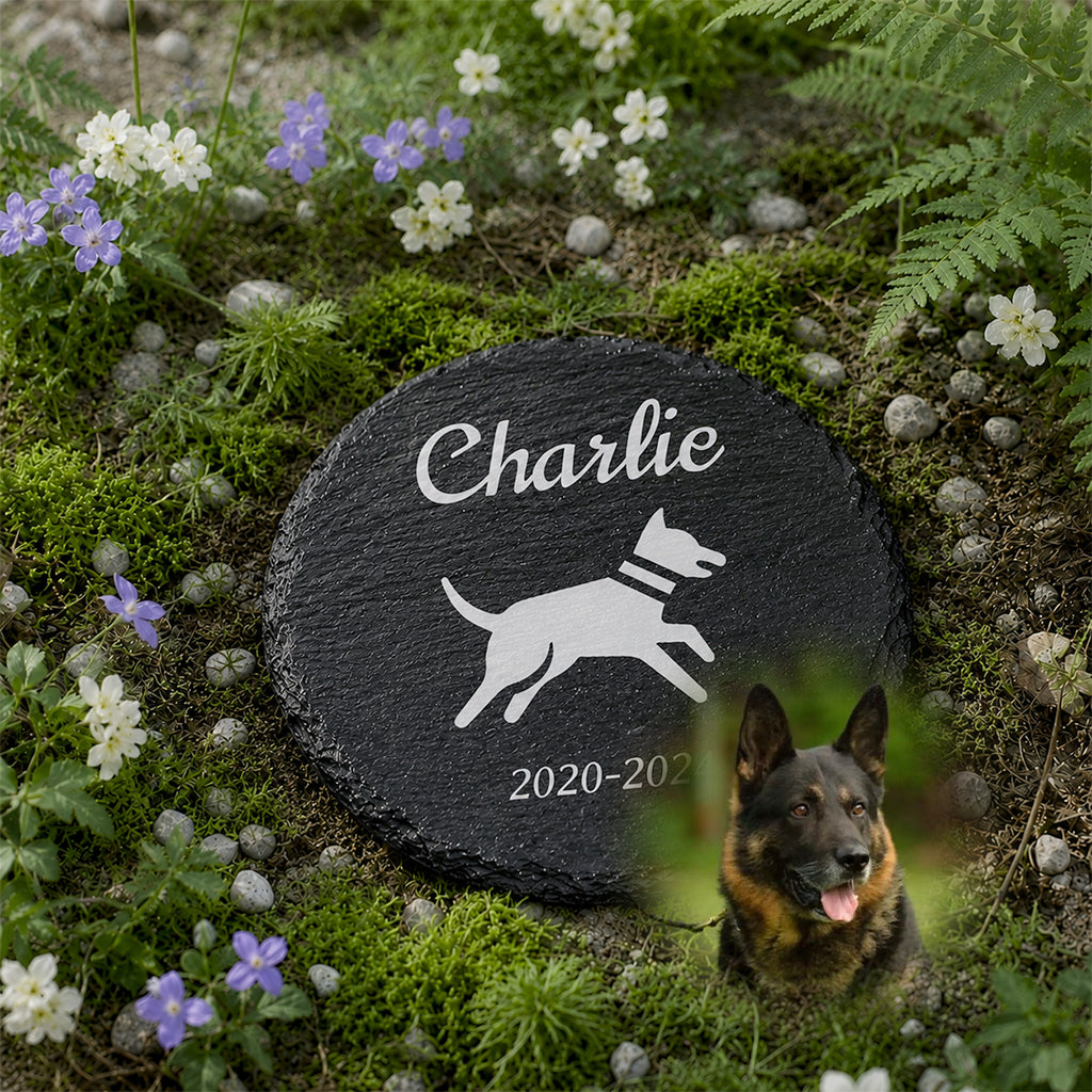 Close-up of laser-engraved dog name and memorial text on a round slate garden grave marker