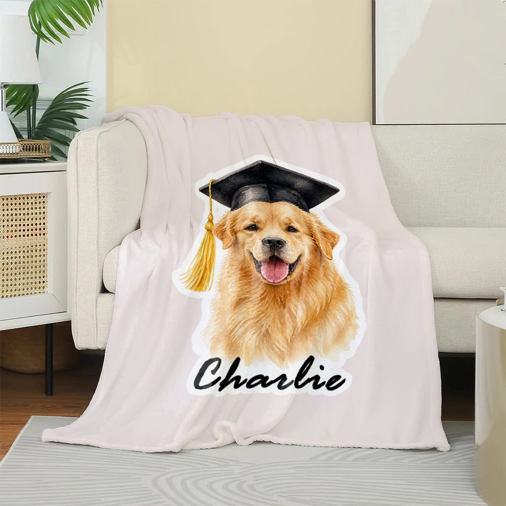 Close-up of watercolor dog graduation illustration with cap and name on a soft fleece blanket