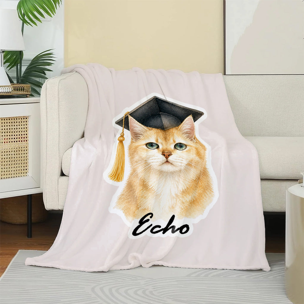 Cat graduation fleece throw draped over a couch showing full personalized cat portrait design
