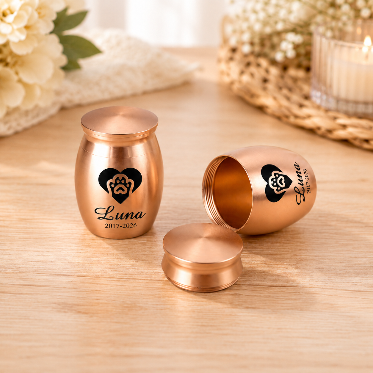 Mini personalized pet cremation urn with engraved name and paw print design in rose gold finish