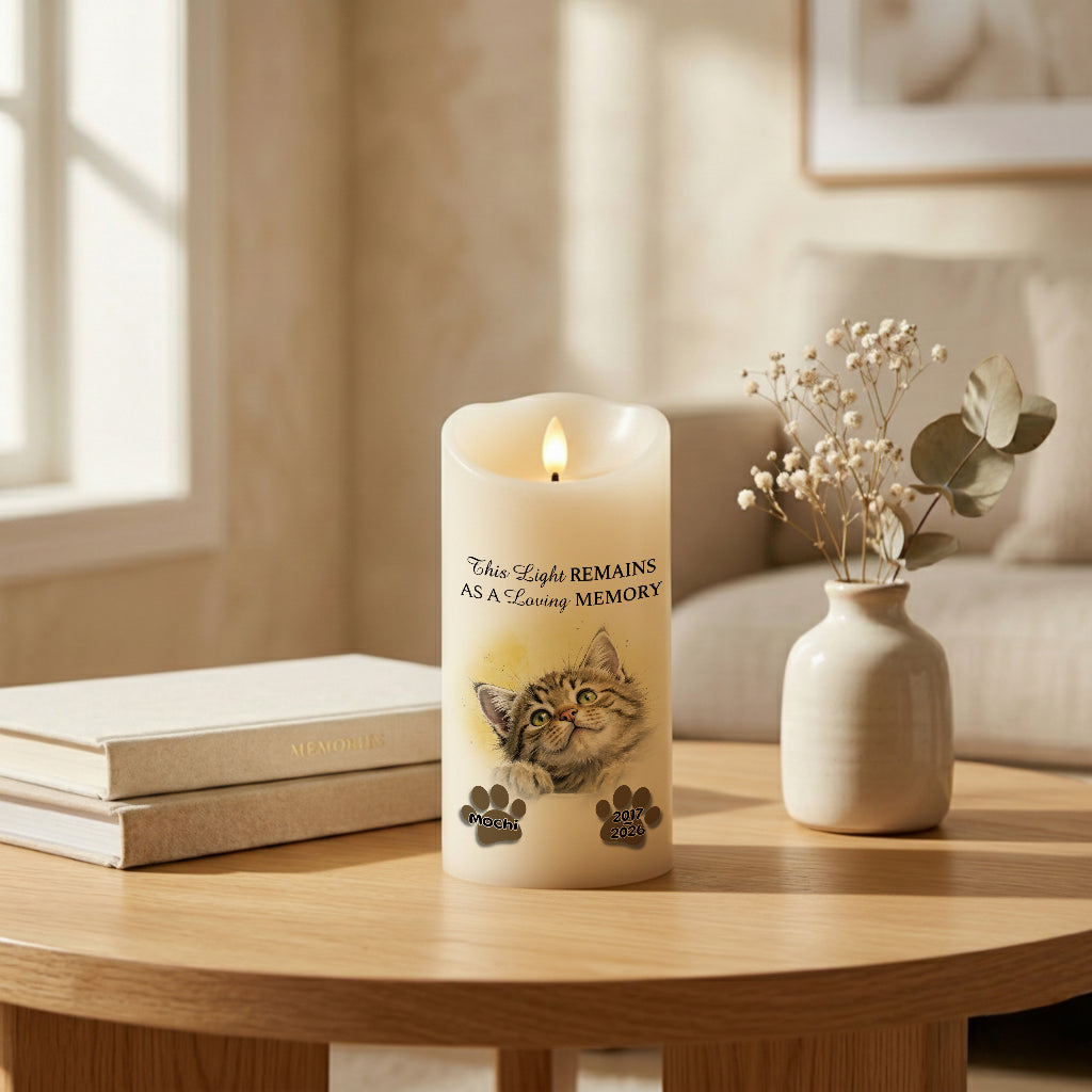 Personalized pet memorial LED candle with peeking pet design lit softly in a warm home setting