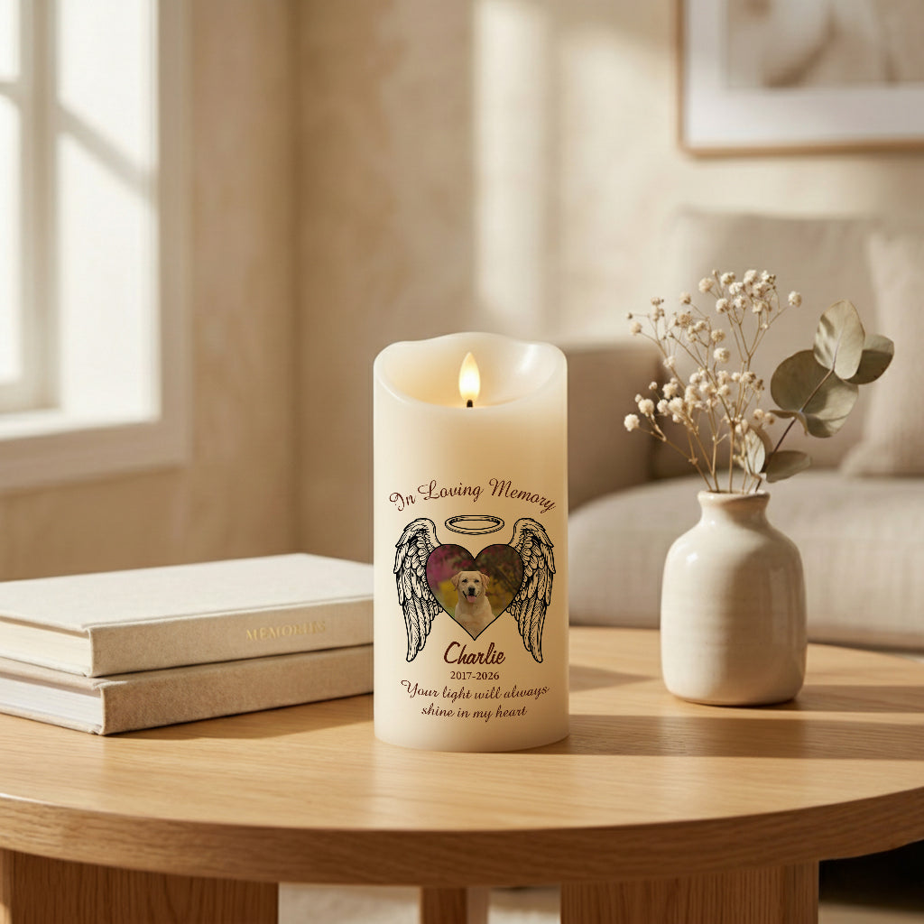 Pet loss memorial LED candle with heart wings glowing warmly on a table as a remembrance gift