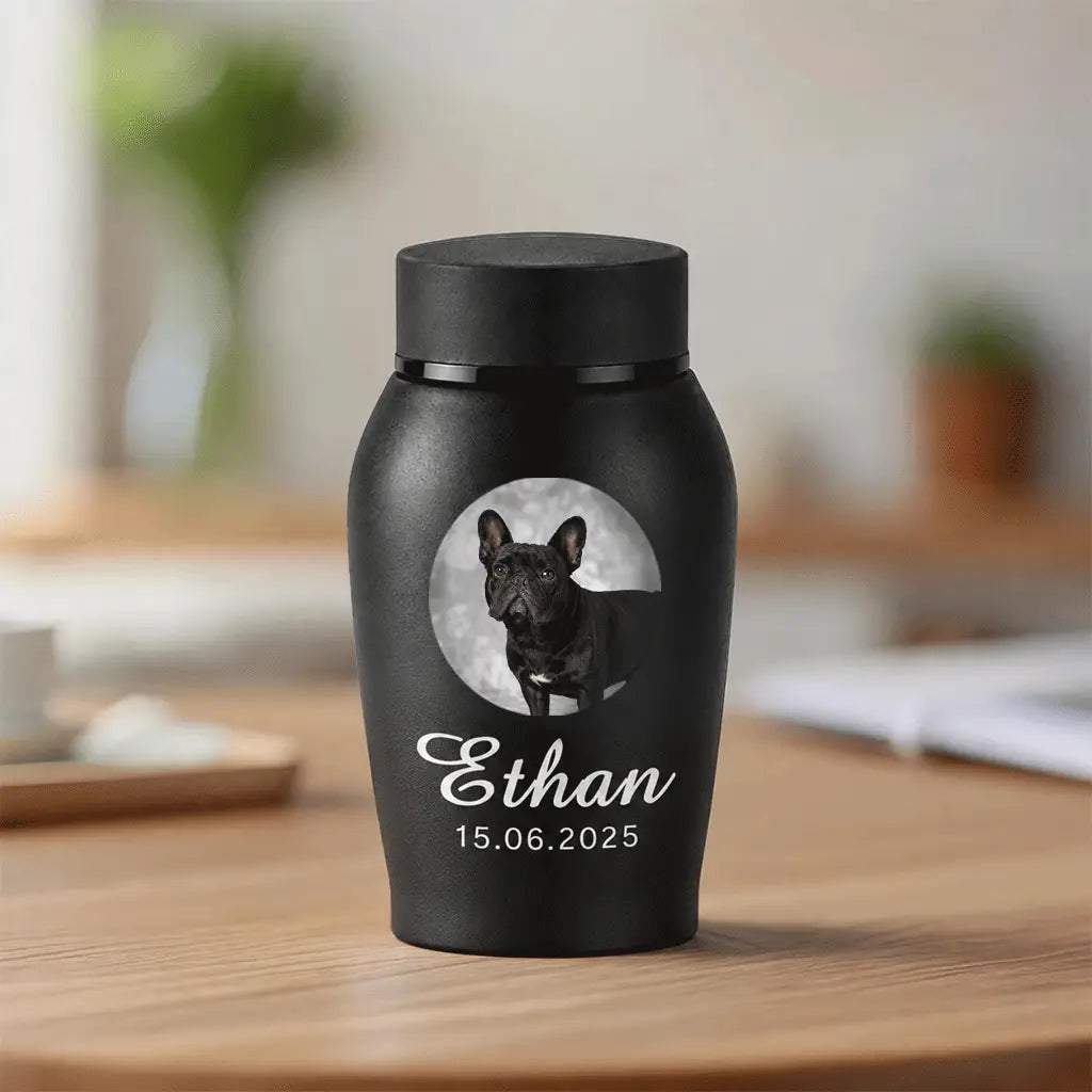 Personalized dog cremation urn with photo, name and dates printed on matte black stainless steel, front view