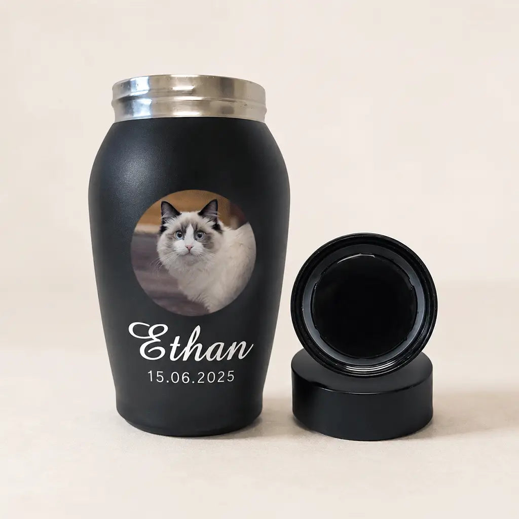 Matte black stainless steel cat cremation urn with secure screw-top lid for safely holding ashes