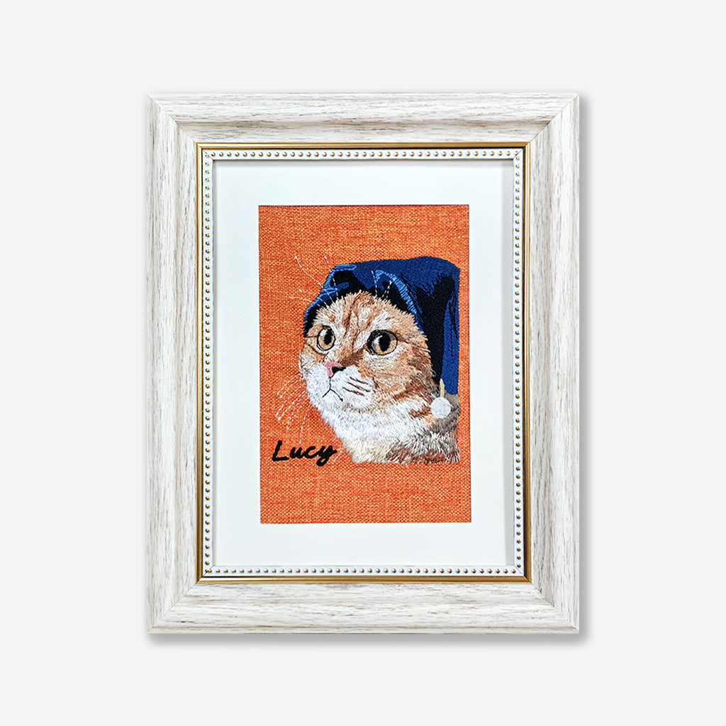 Custom pet portrait embroidery on natural linen in a white frame as a personalized pet lover gift