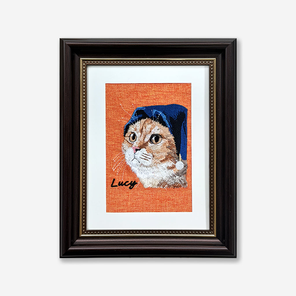 Custom pet memorial embroidery portrait on natural linen in a dark frame as a pet loss gift
