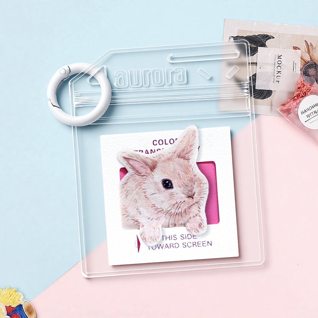 Custom bunny watercolor keychain attached to a set of keys showing everyday carry size