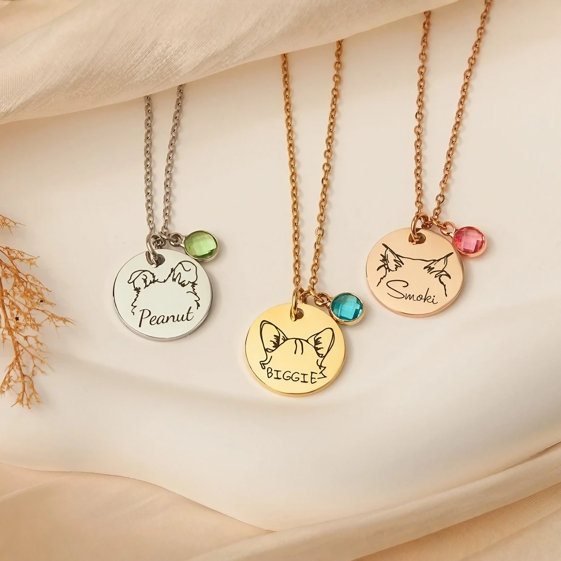 Birthstone color options chart for the personalized pet portrait necklace showing all 12 months