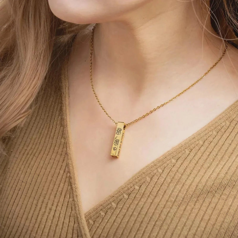 Custom pet memorial bar necklace with slim engraved pendant showing pet name in gold finish