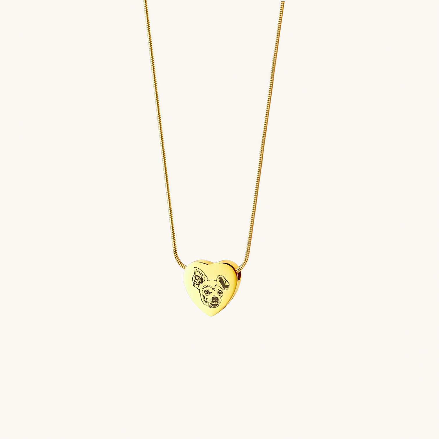 Heart-shaped pet memorial necklace with custom engraved pet portrait on polished metal