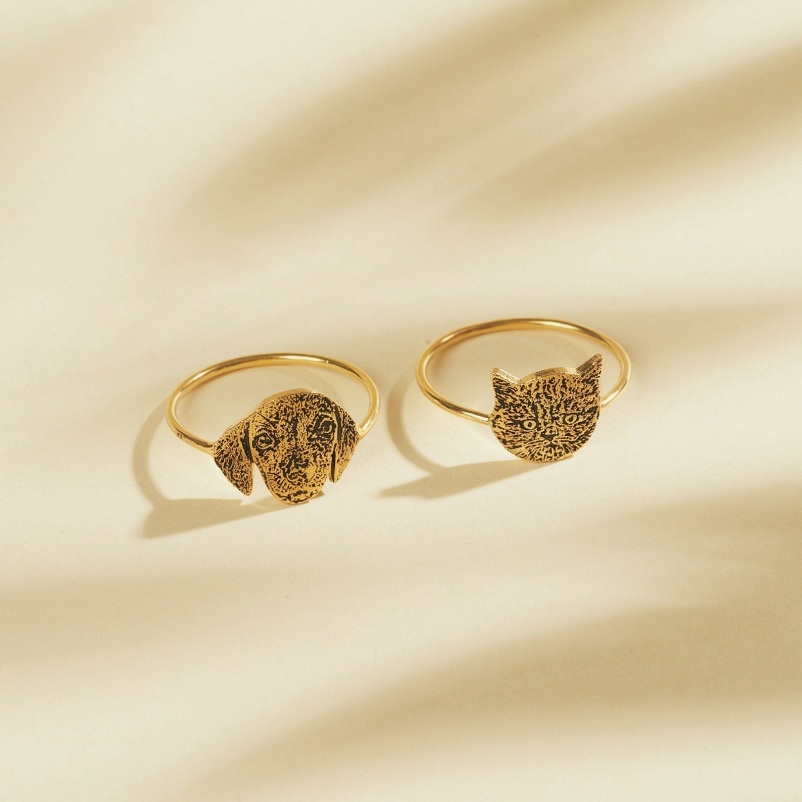 Close-up of engraved pet face shape on a custom pet portrait ring band