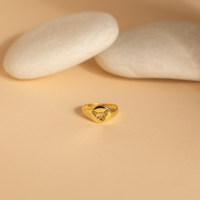 Person wearing a personalized pet portrait signet ring as a statement pet keepsake piece