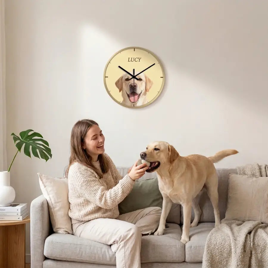 Personalized pet portrait wall clock displayed on a living room wall showing full clock face