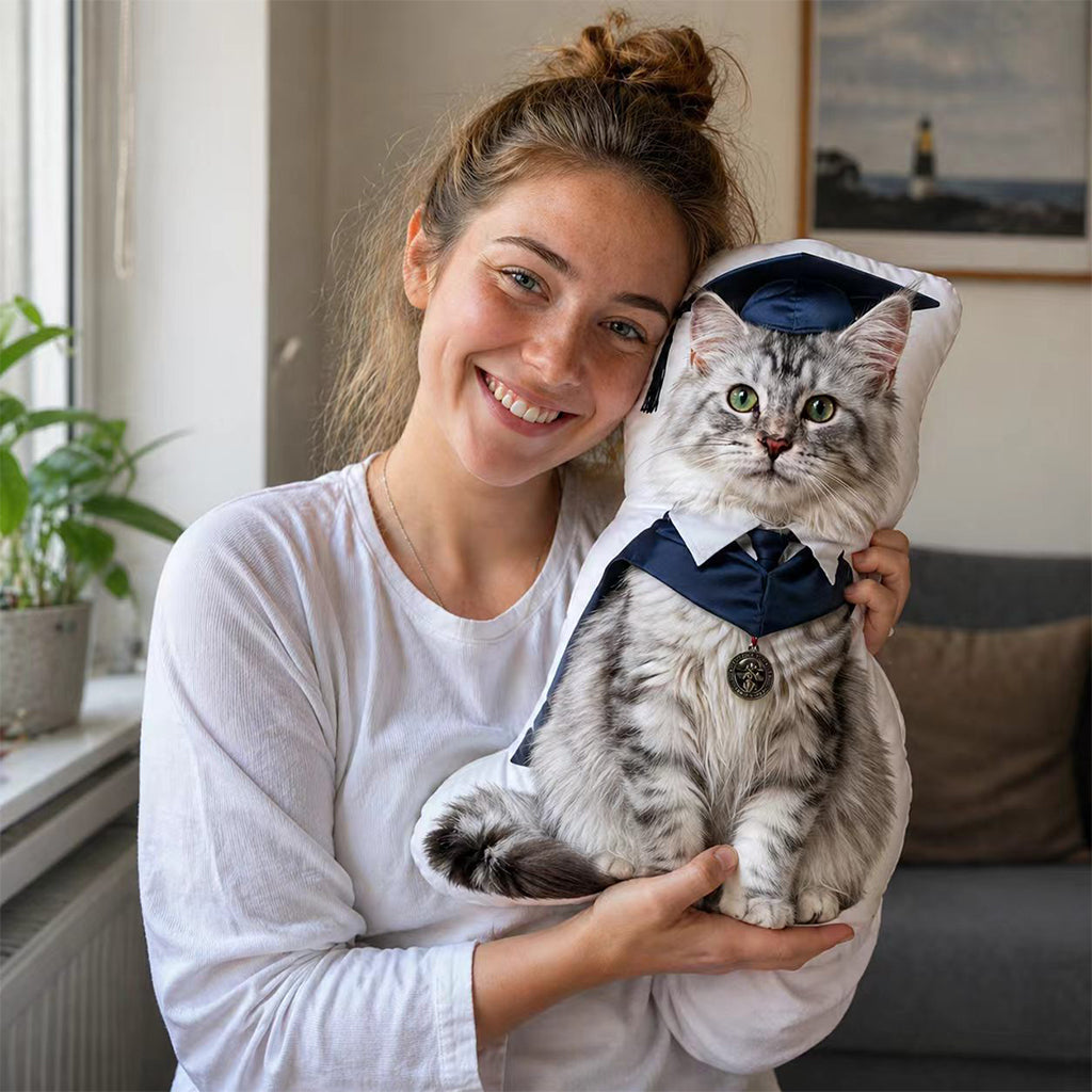 Close-up of full-body pet graduation pillow showing cap, gown, and custom pet portrait detail