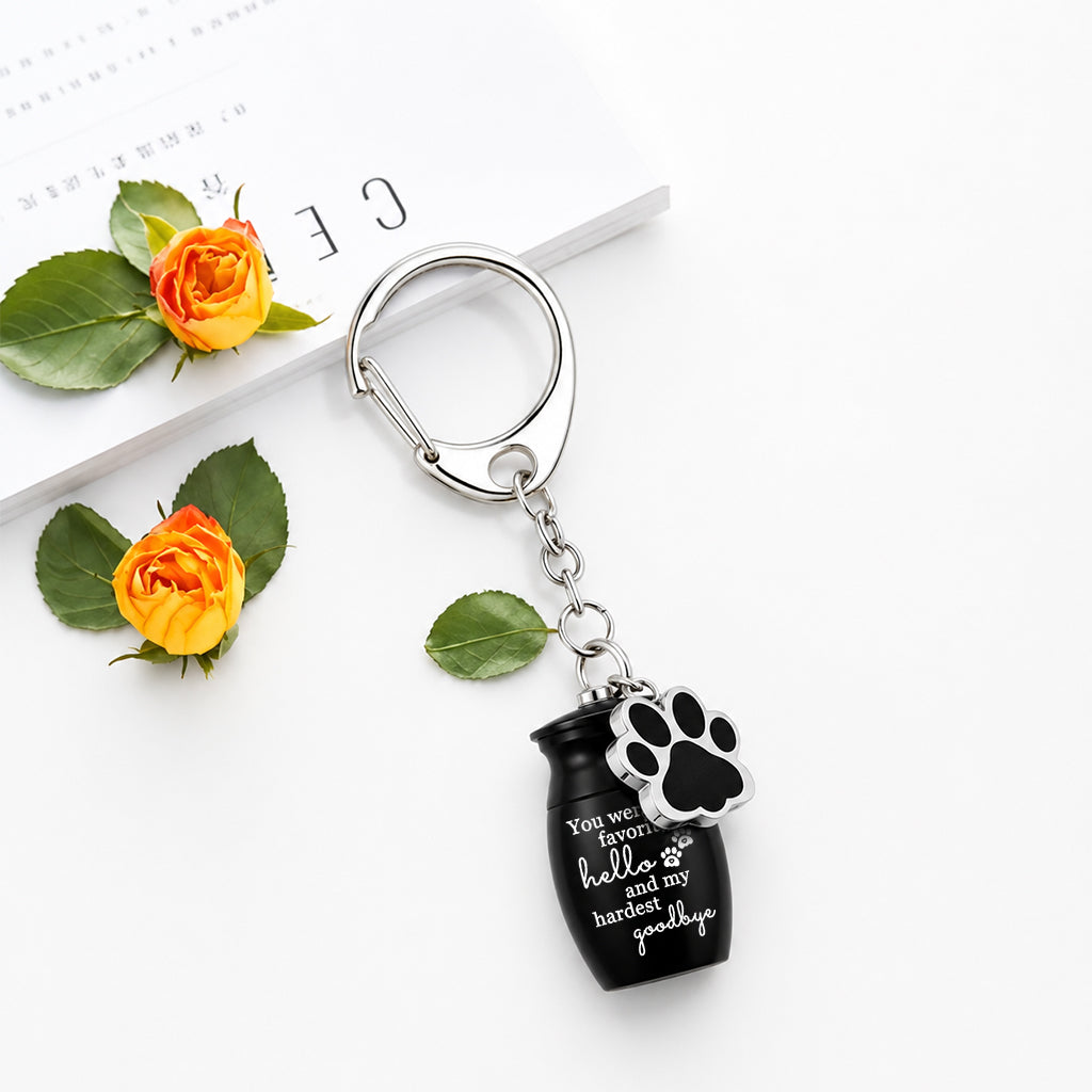 Pet cremation urn keychain attached to a set of keys showing portable everyday carry size