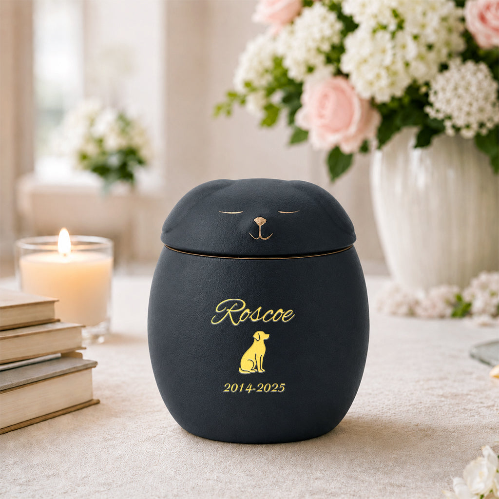 Black ceramic dog-shaped memorial urn with custom pet name as a dog loss keepsake