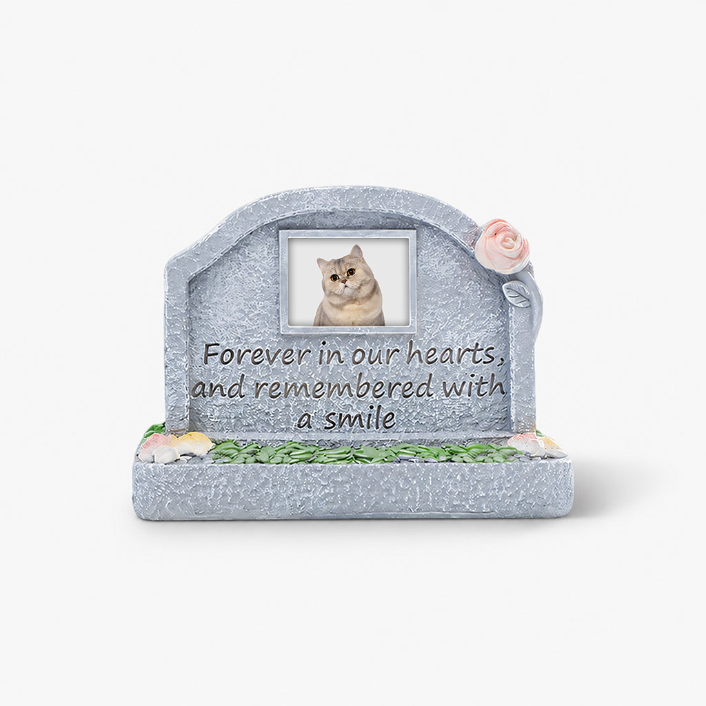 Close-up of photo slot and engraved text detail on a cat memorial resin figurine