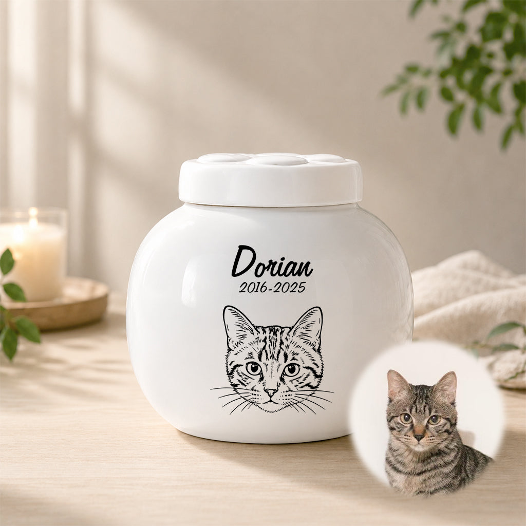 Side view of custom cat urn showing portrait illustration and smooth ceramic finish