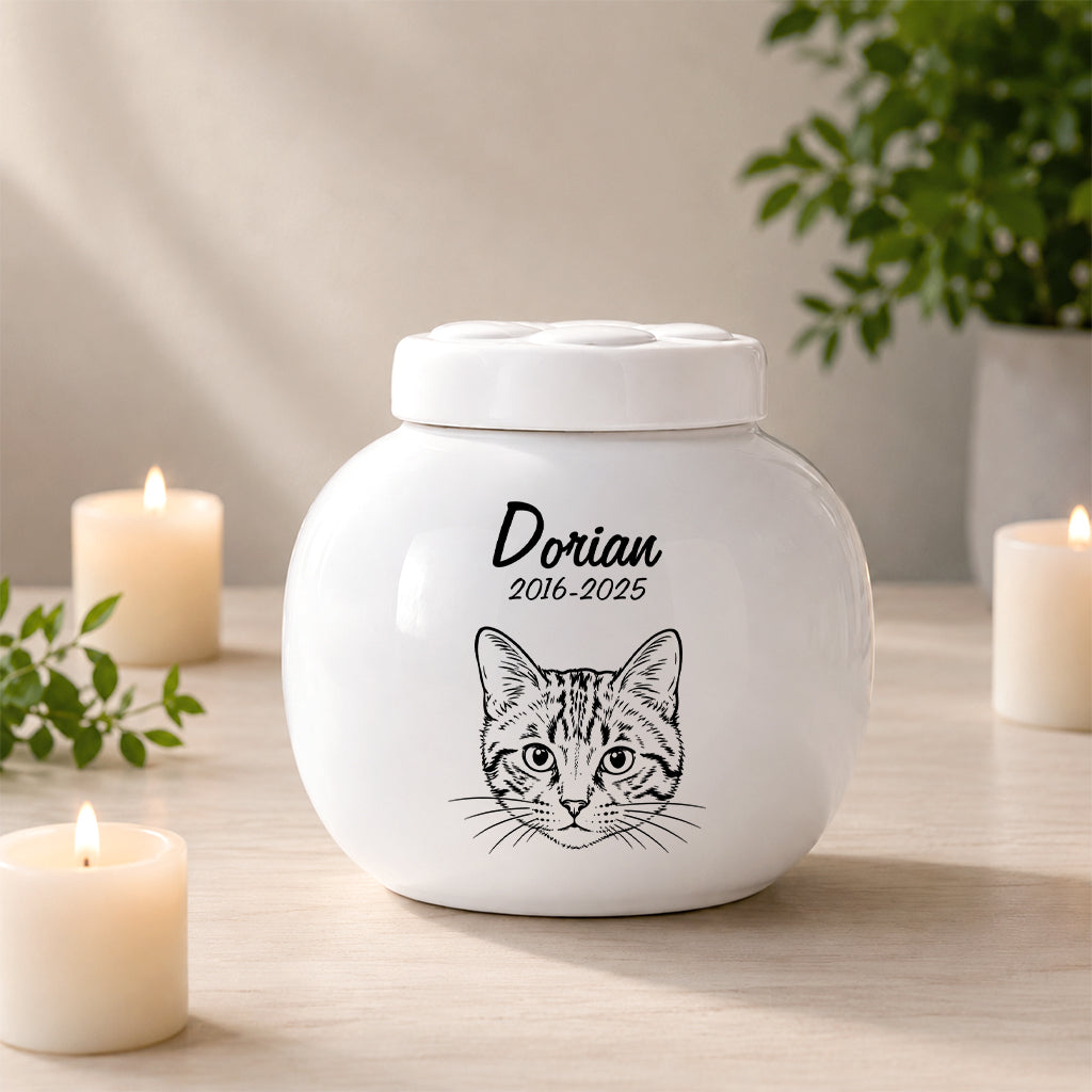 Custom cat cremation urn with realistic portrait, engraved name and dates on white ceramic jar