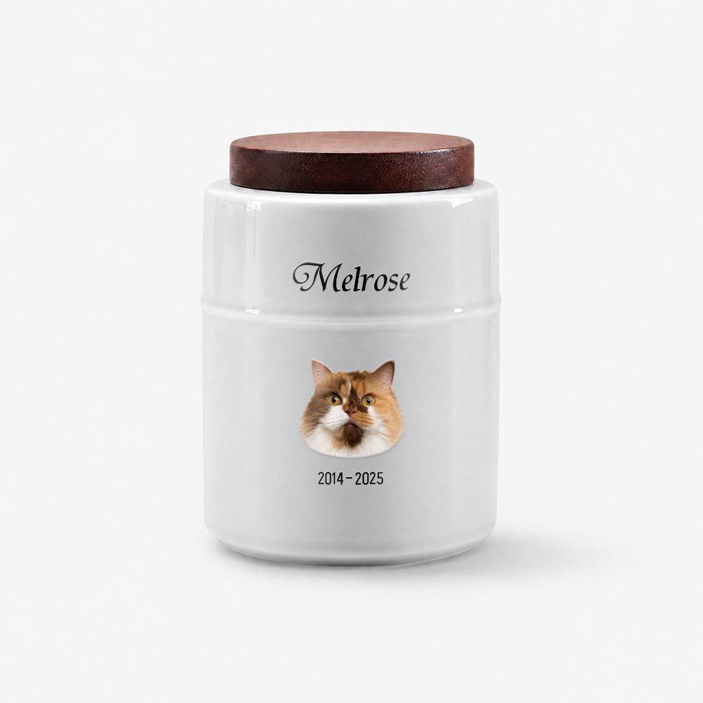 Personalized white cat cremation urn with wood lid displayed on a shelf as a cat memorial keepsake