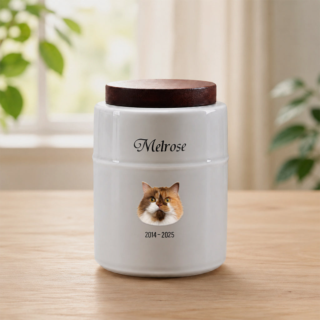 White ceramic cat cremation urn with dark wood lid and realistic cat portrait printed on front