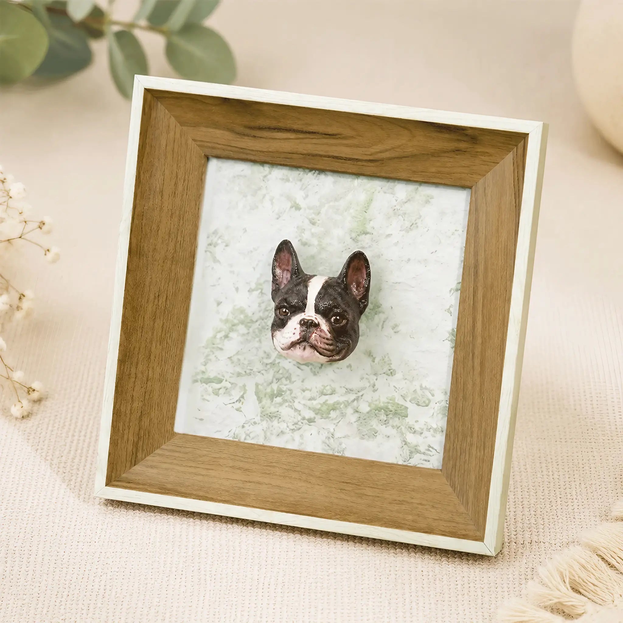 Close-up of the hand-painted plaster French Bulldog sculpture inside the wood portrait frame