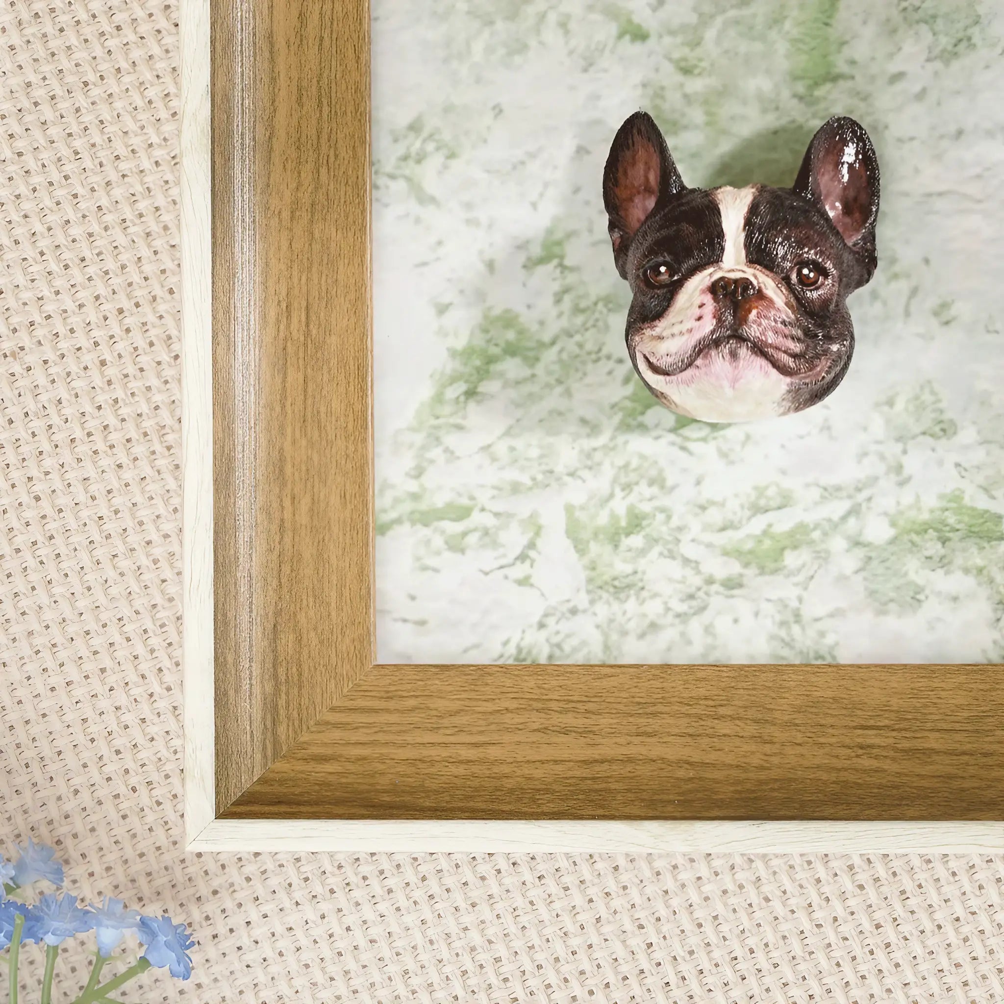 Custom 3D pet portrait frame displayed on a wooden shelf as home decor with a vase and lamp