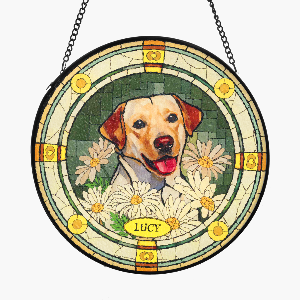 Custom stained glass pet suncatcher with a painted pet portrait, white daisies and the name Lucy, hanging from a chain