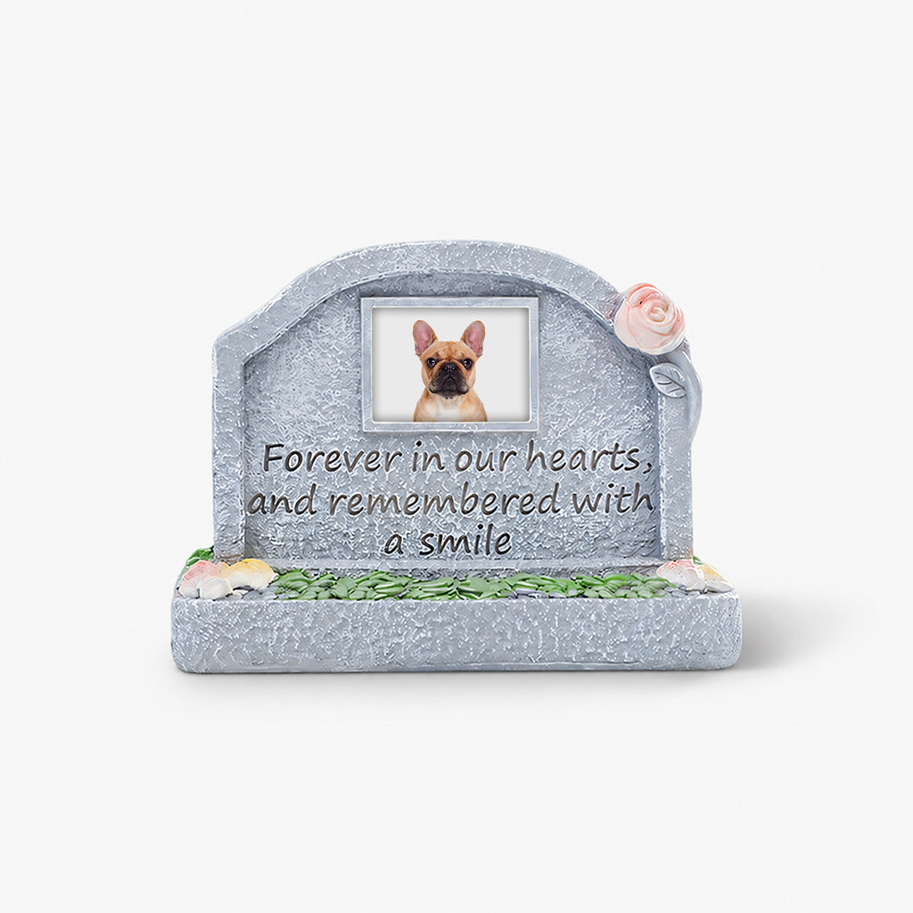 Close-up of photo slot and engraved text detail on a dog memorial resin figurine