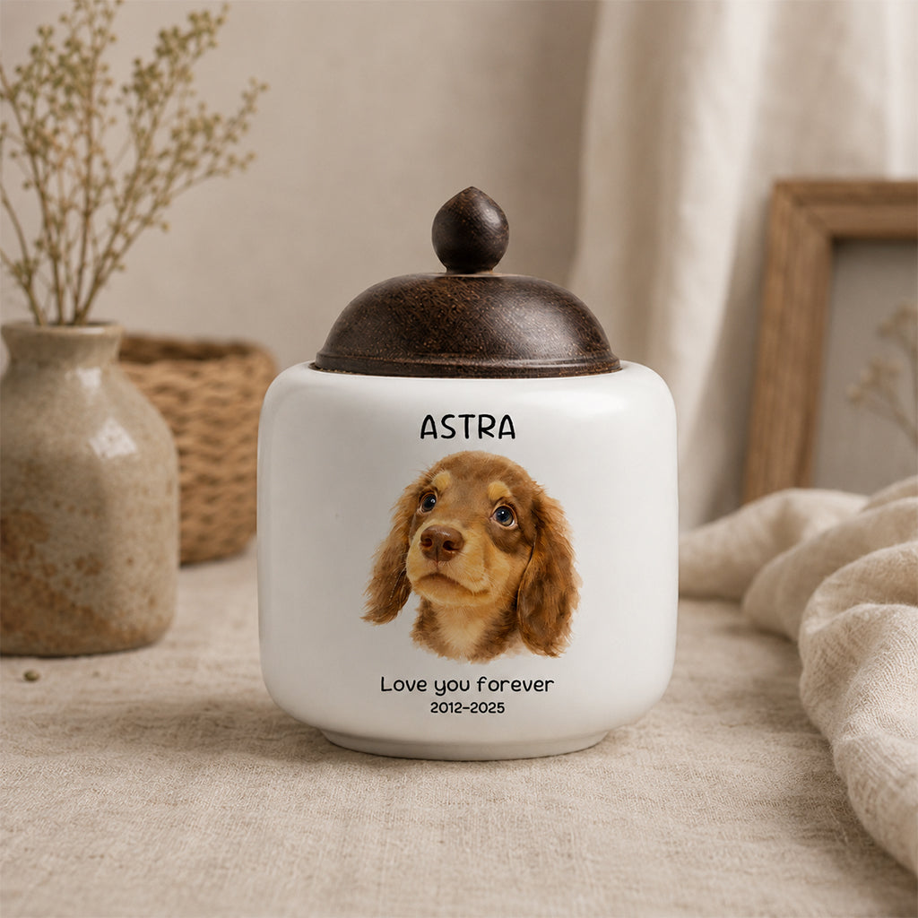 Custom dog cremation urn with soft watercolor portrait on a white ceramic jar with natural wood lid