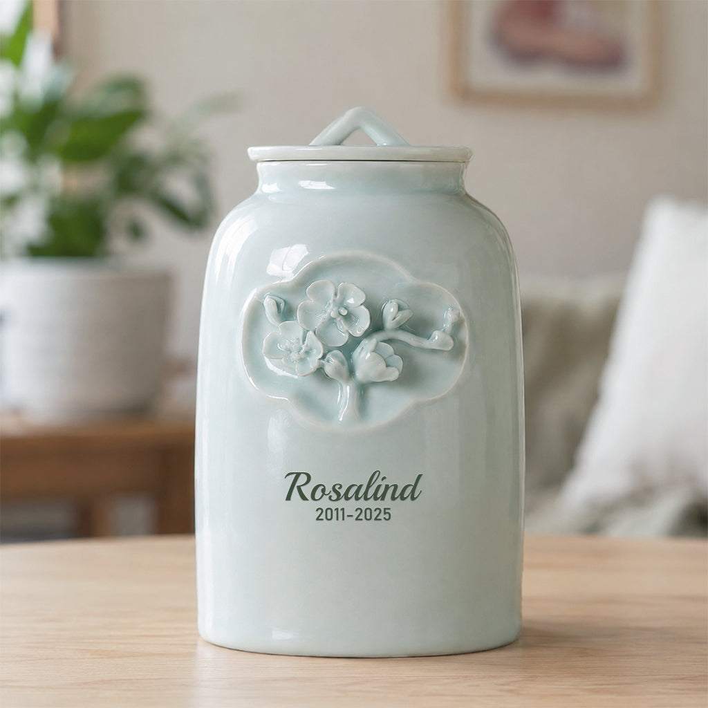 Side view of floral relief ceramic pet memorial urn showing delicate raised petal detail