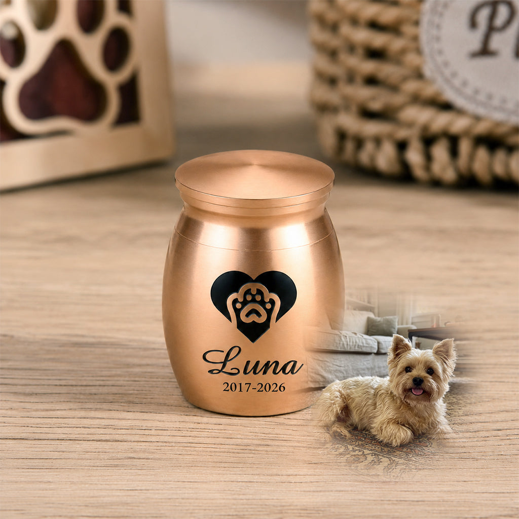 Close-up of engraved pet name and memorial date on a small keepsake cremation urn