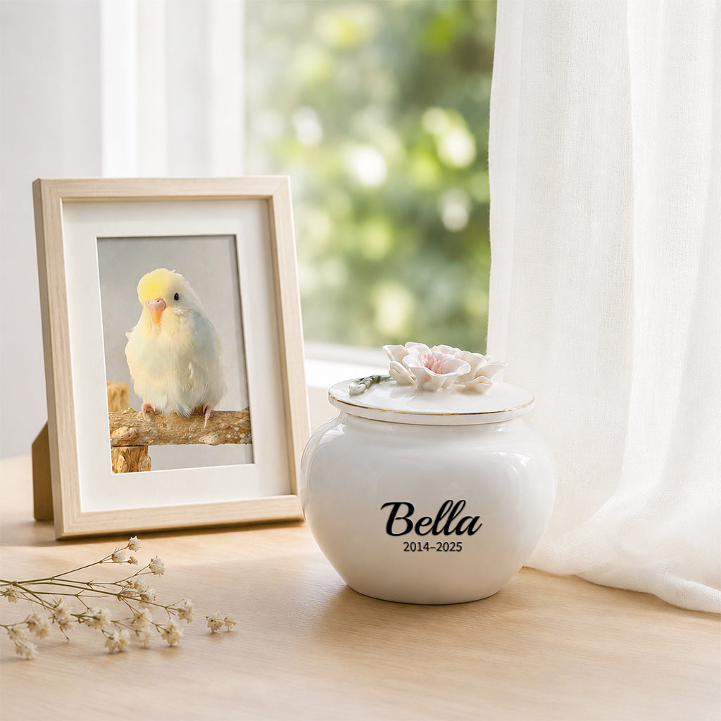 Pink ceramic pet keepsake urn with sculpted chrysanthemum lid shown as a personalized pet memorial gift