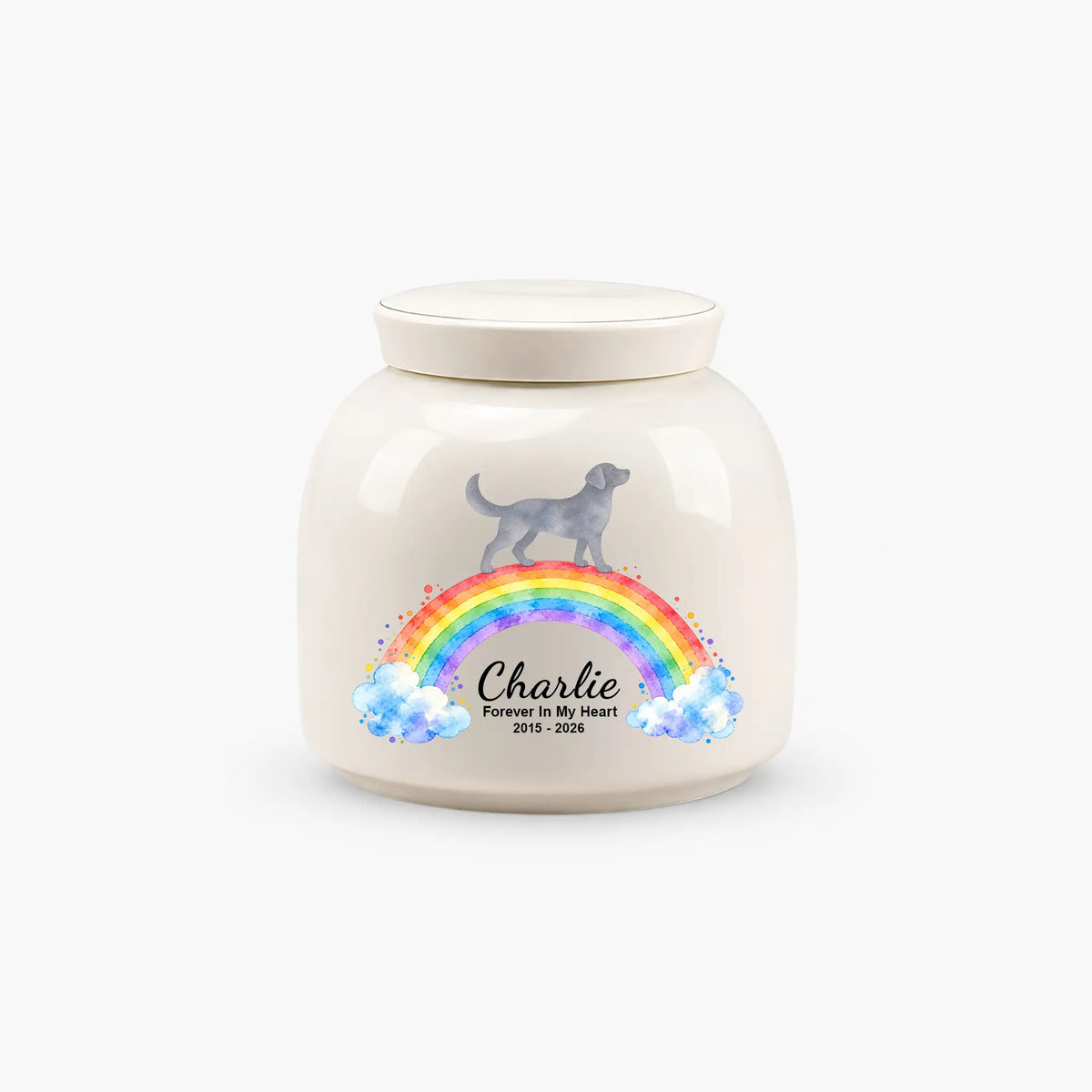 Rainbow bridge dog cremation urn in cream ceramic, with a dog on a watercolor rainbow and a personalized name