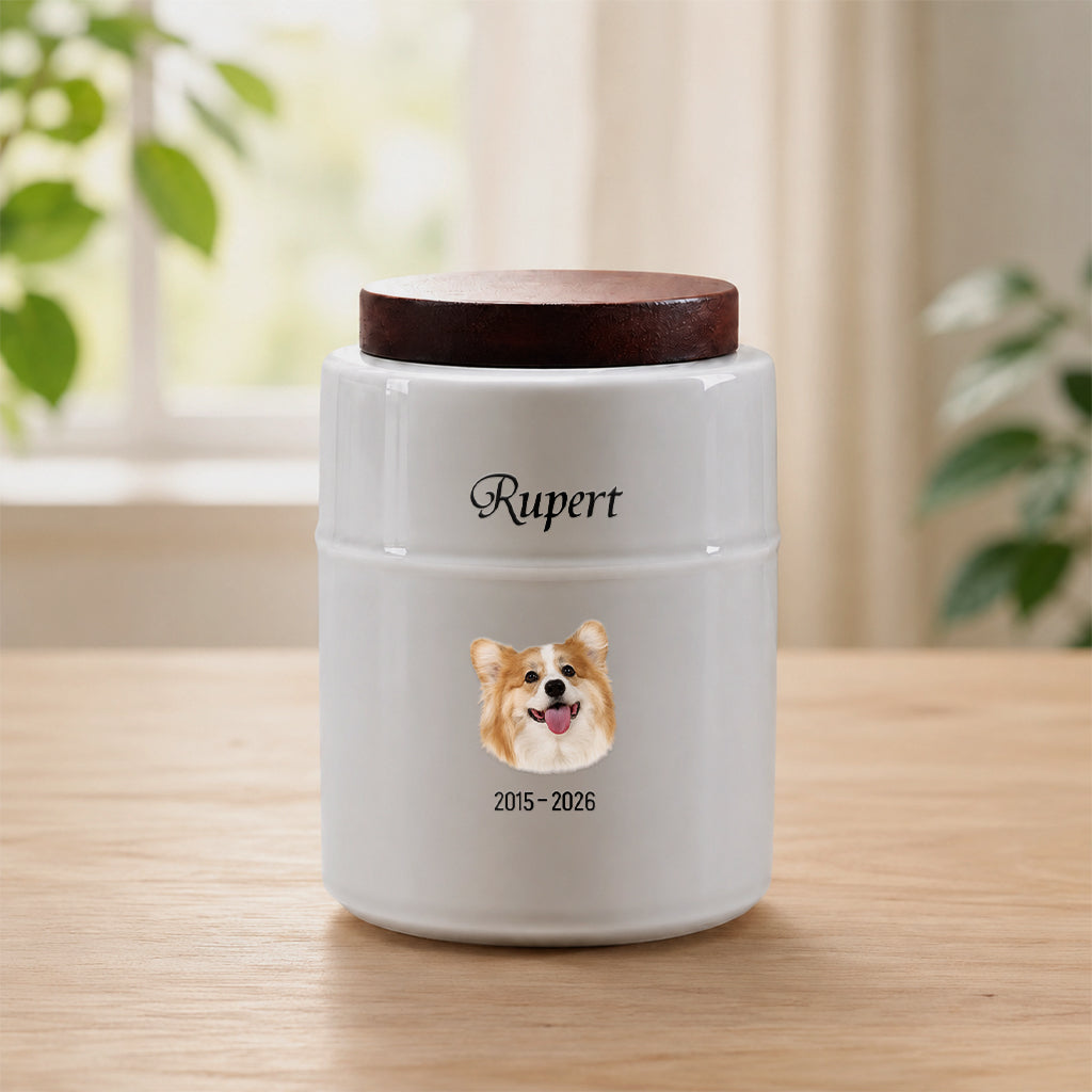 White ceramic dog cremation urn with dark wood lid and realistic dog portrait printed on front