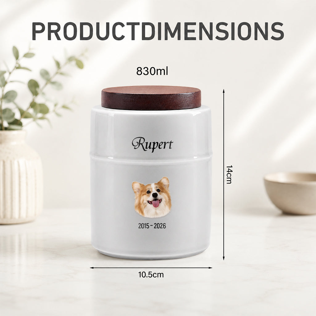 Close-up of custom dog portrait and name printed on a white ceramic cremation urn with wood lid