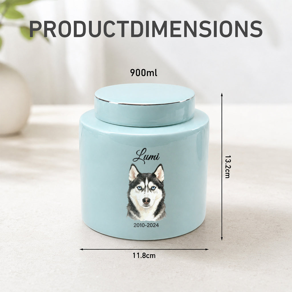 Teal dog cremation urn displayed on a wooden surface as a personalized dog memorial keepsake