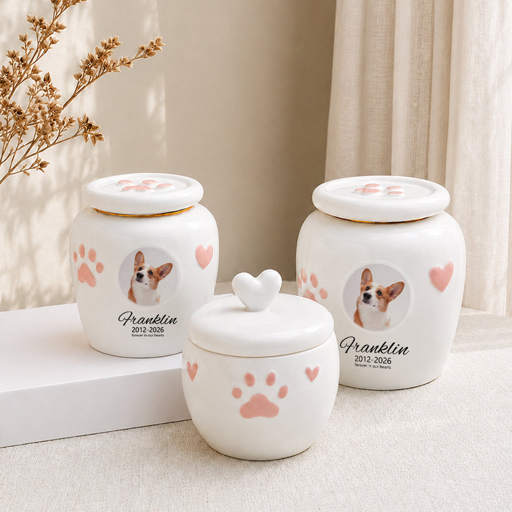 Dog memorial urn with photo window displayed on a shelf as a personalized dog loss keepsake