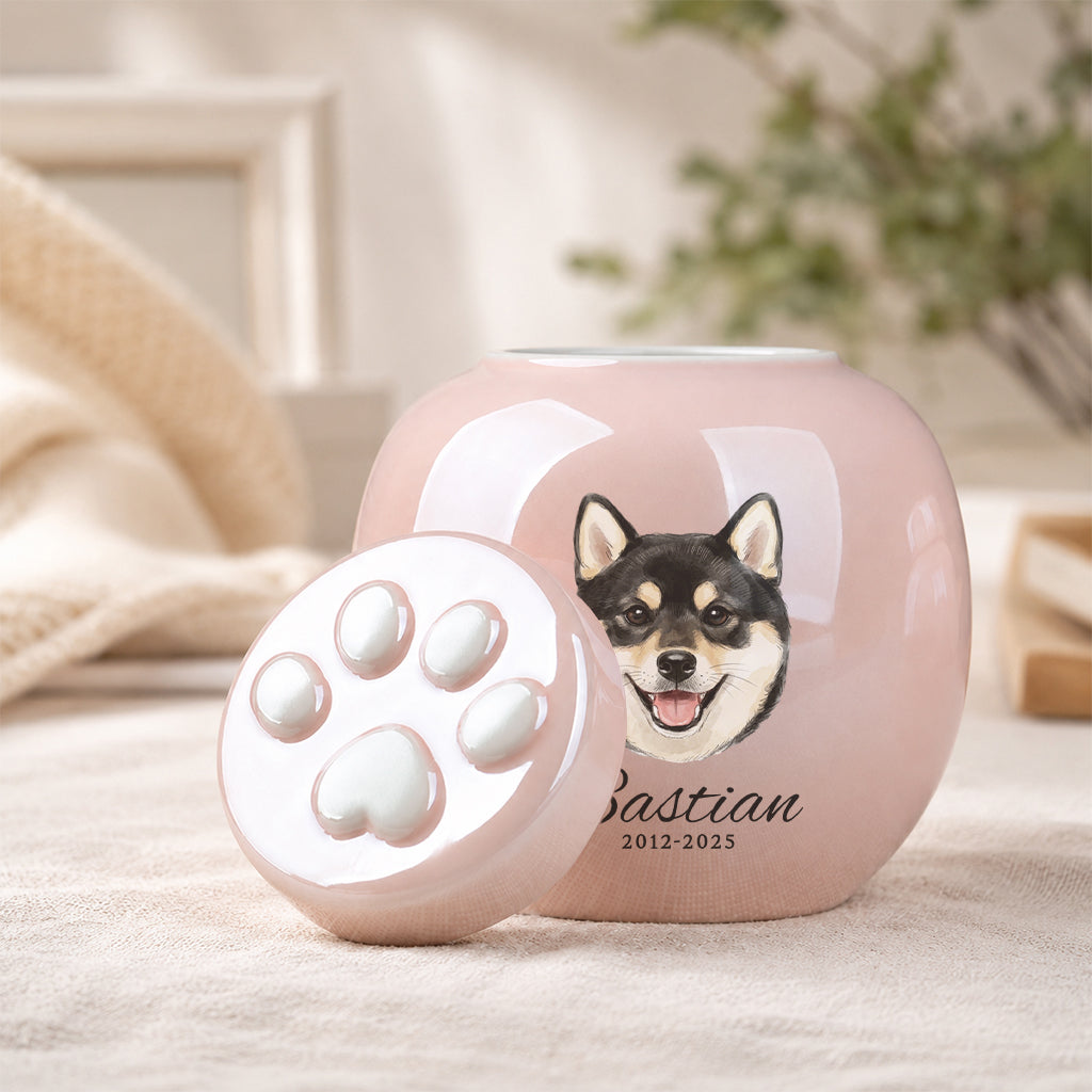 Pink dog cremation urn displayed on a surface as a personalized dog loss memorial keepsake