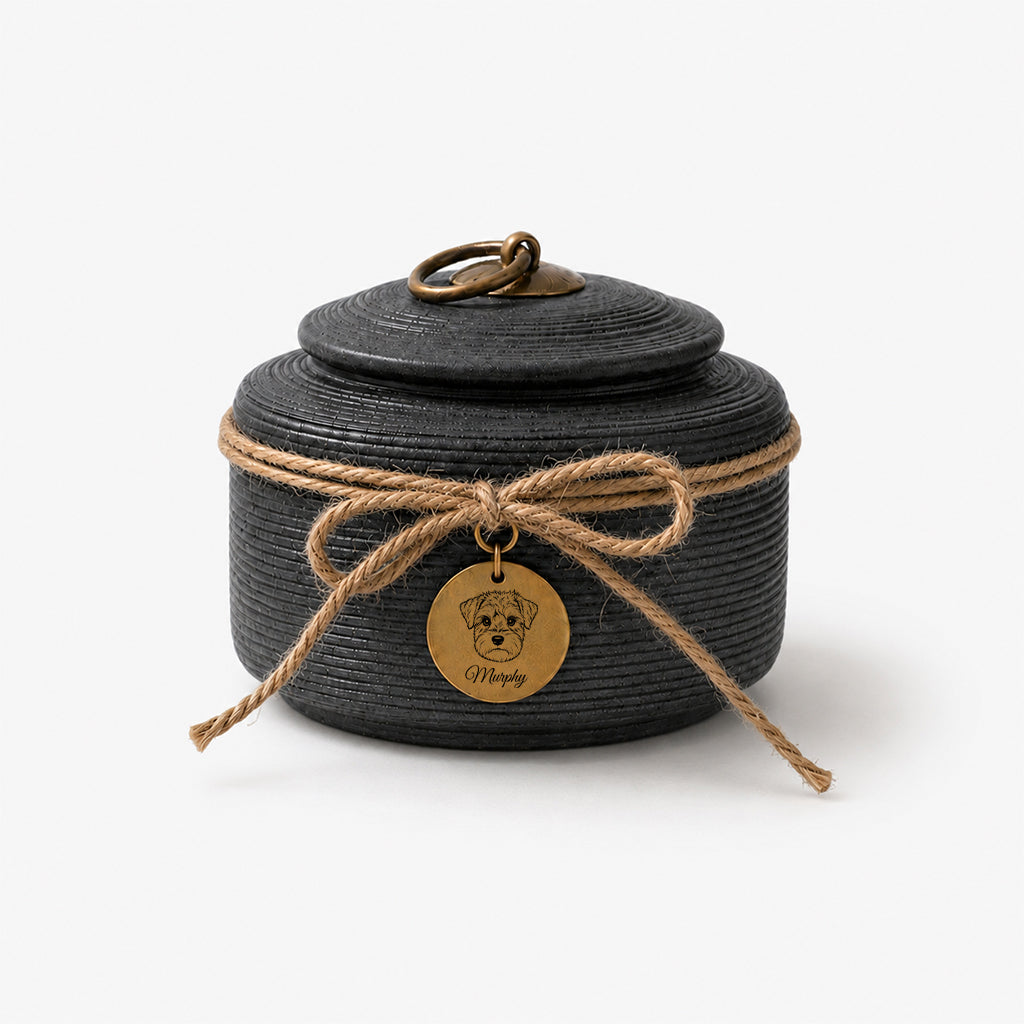 Detail of textured ceramic surface and jute bow on a personalized dog memorial urn