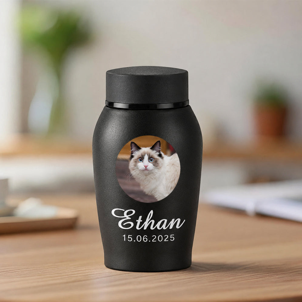 Personalized cat cremation urn with photo showing engraved cat portrait, name, and memorial dates