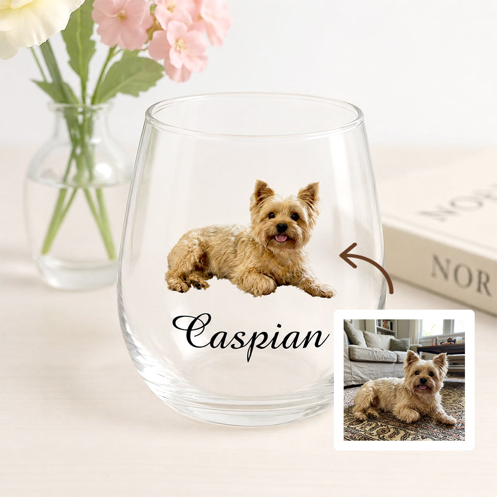 Personalized pet photo wine glass held up showing custom pet portrait in a lifestyle setting