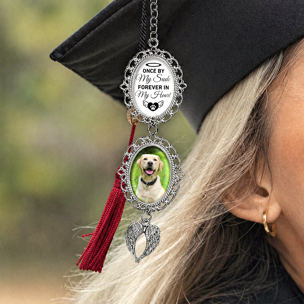 Close-up of pet portrait inside an angel wings frame on a custom graduation tassel charm