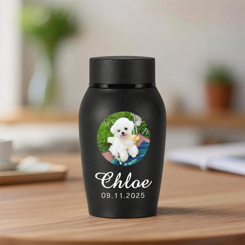 Personalized dog cremation urn with photo showing engraved dog portrait, name, and memorial dates
