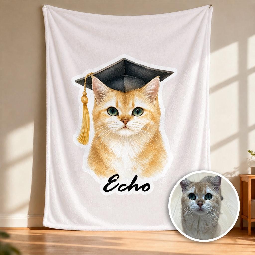 Close-up of watercolor cat graduation illustration with cap and name on a soft fleece blanket