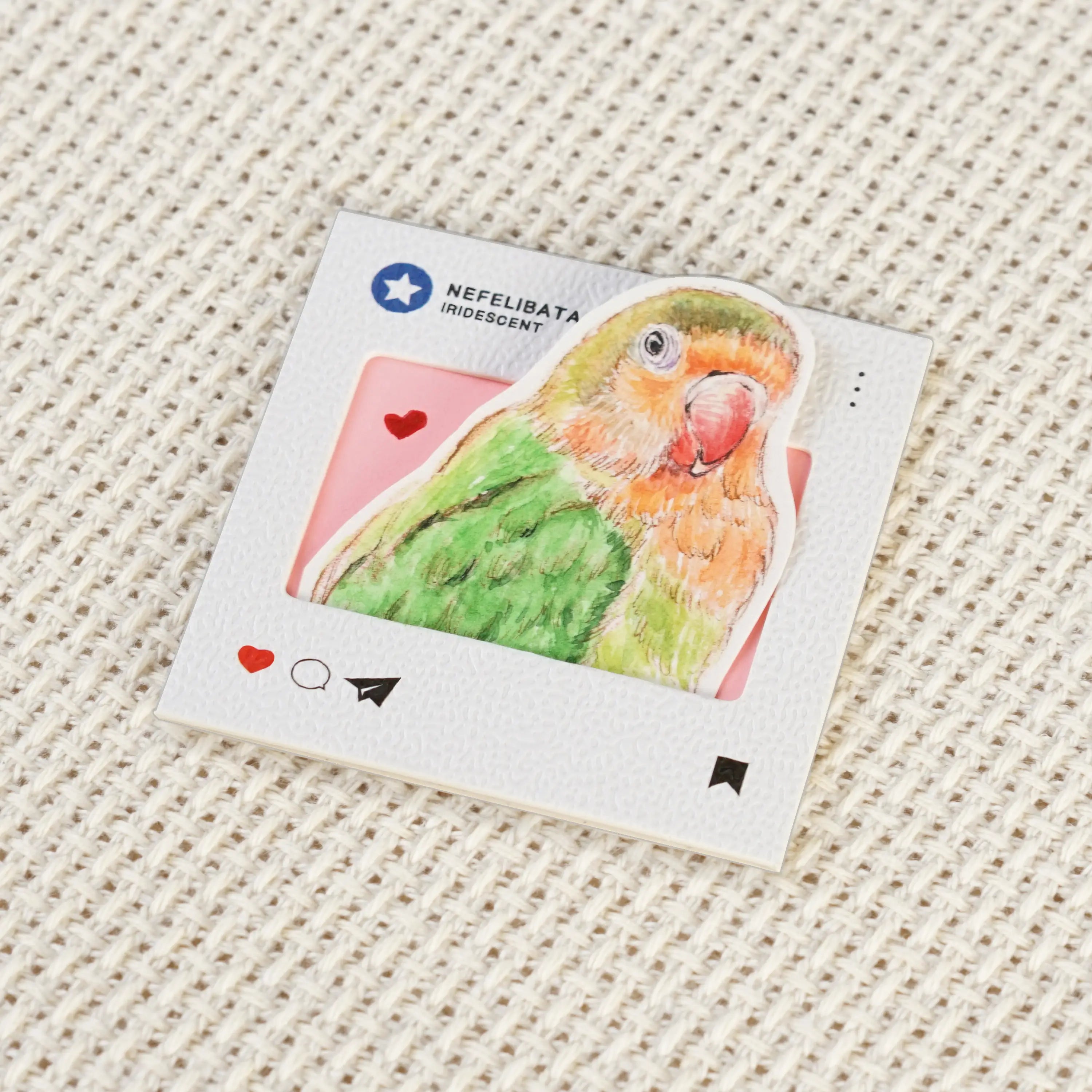 Hand-painted watercolor art detail on a custom parrot keychain